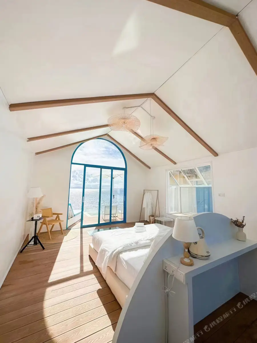 King bed with arched door in Couple Suite at Royal Resort Semporna