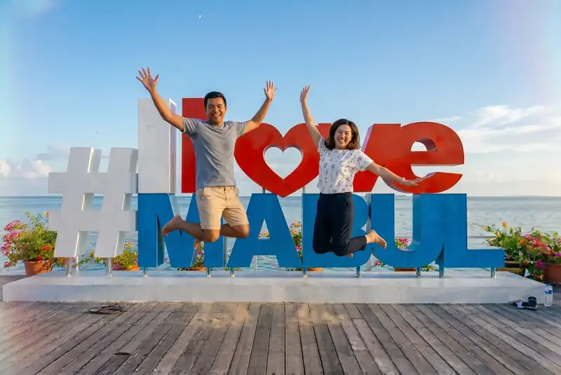 Famous photo spot at the I Love Mabul sign on Mabul Island Semporna Royal Resort