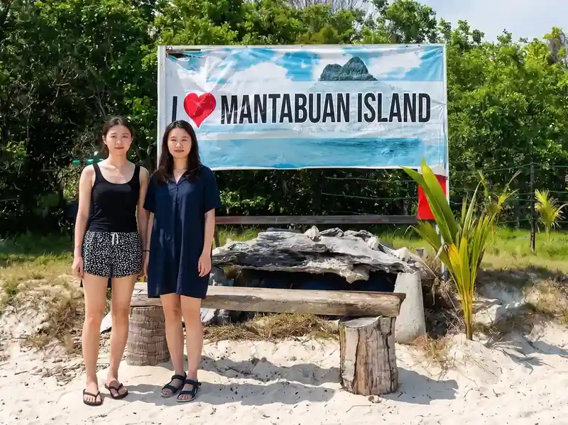 Snorkeling and island hopping at Mantabuan Island with Semporna Royal Resort in the Semporna Islands area.